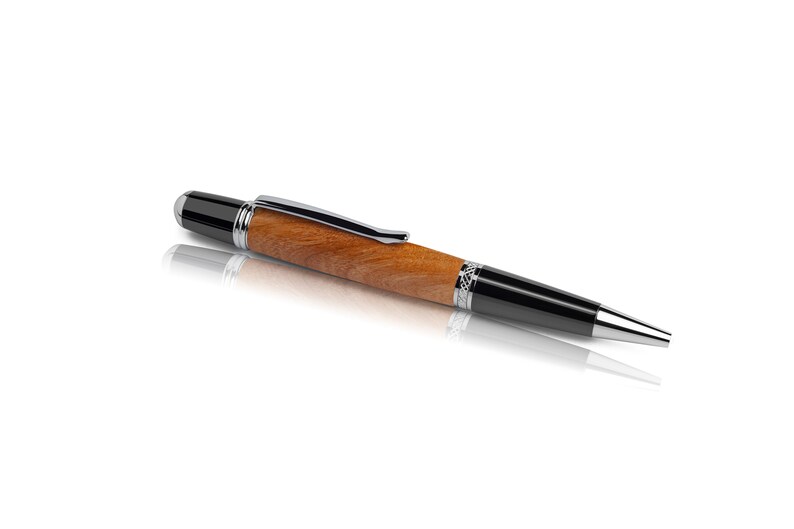 Handmade ballpoint pen made of cherry wood