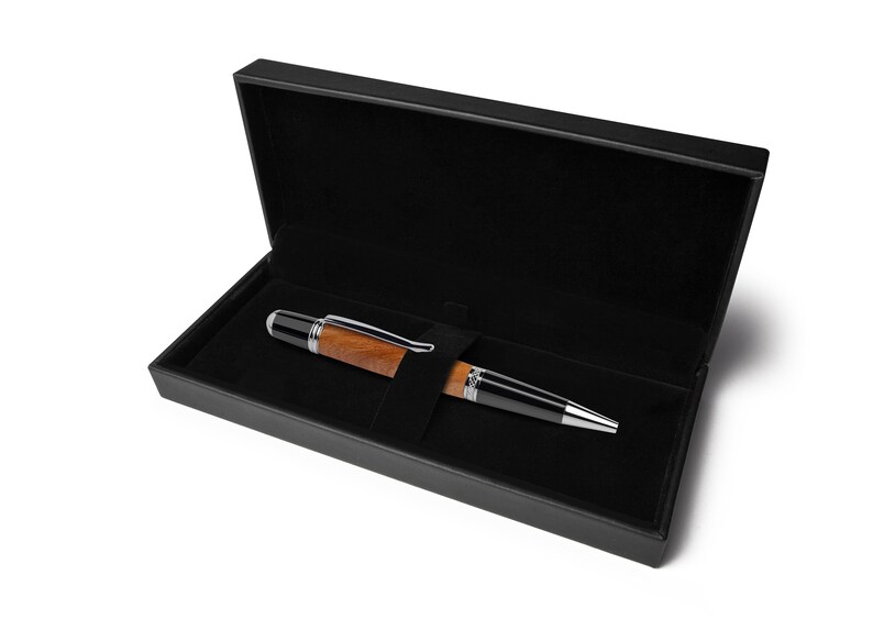 Handmade ballpoint pen made of cherry wood