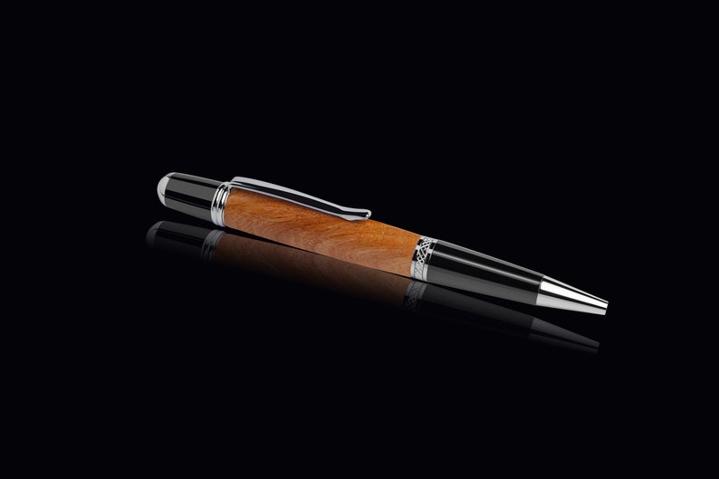 Handmade ballpoint pen made of cherry wood