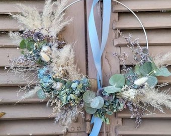 Door wreath of dried flowers, eucalyptus, pampas grass, hydrangeas.