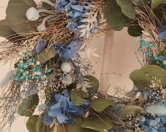 Wreath made of dried flowers, can be used as a table wreath or door wreath.