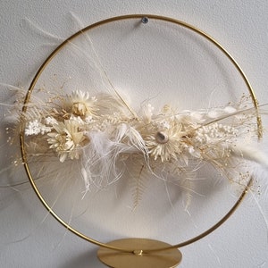 Standing ring decorated with dried flowers