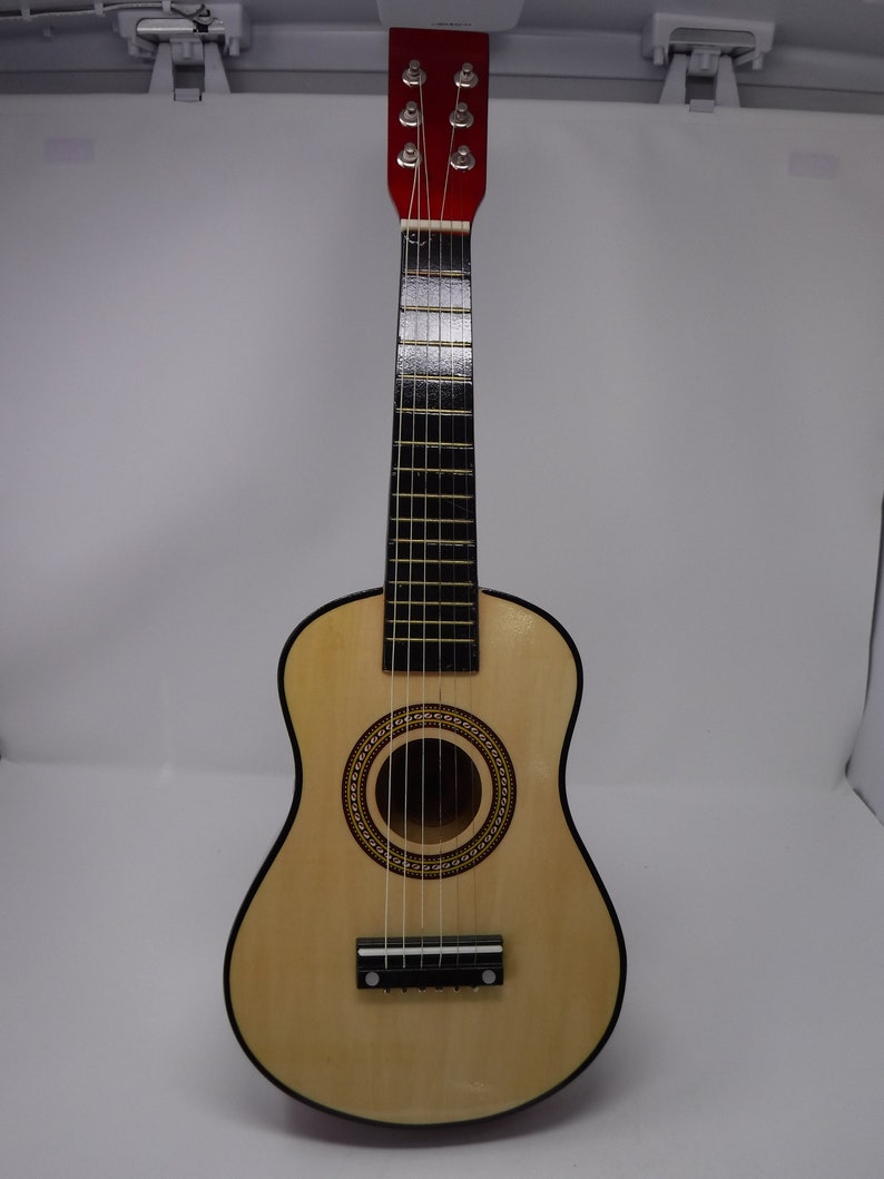 kids toy wooden guitar tunes like a real guitar makes real sounds