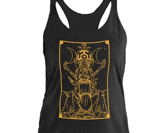 May include: A black tank top with a gold outline of the tarot card "The Moon" featuring a woman with three moons above her head and two wolves at her feet.