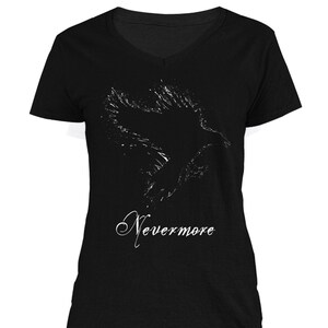 May include: Black v-neck t-shirt with a white silhouette of a raven flying and the text "Nevermore" printed on the front.