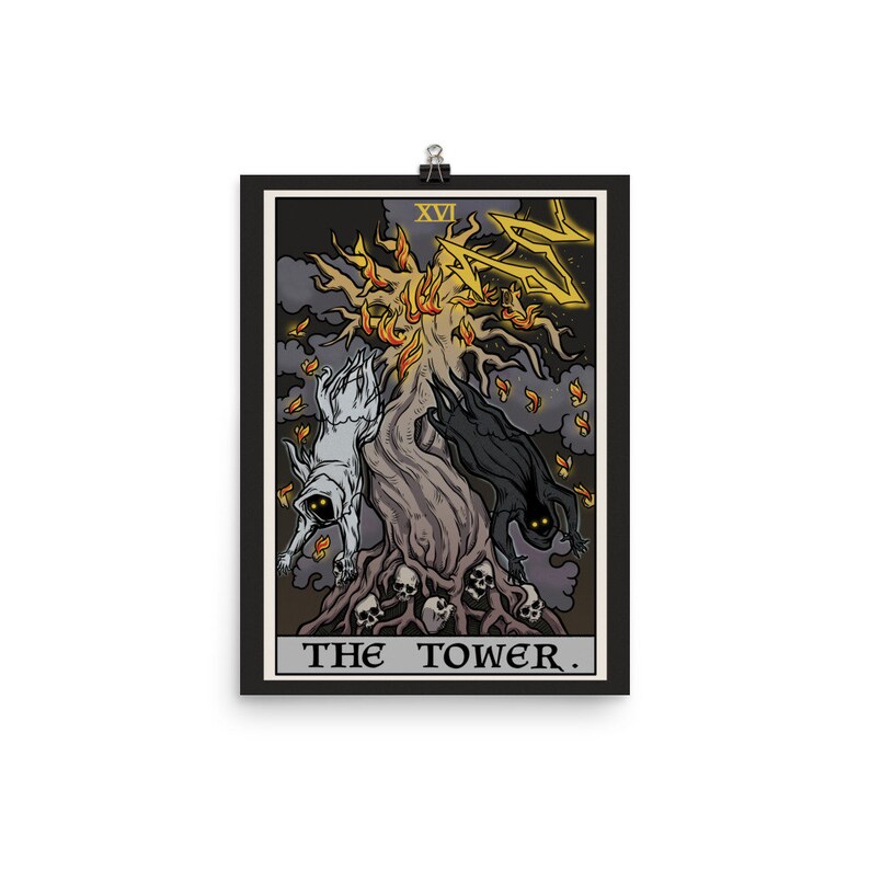 May include: The Tower tarot card illustration. A black and white figure falls from a burning tree with lightning striking it. The card number XVI is in the top right corner. The text "THE TOWER." is at the bottom of the card.