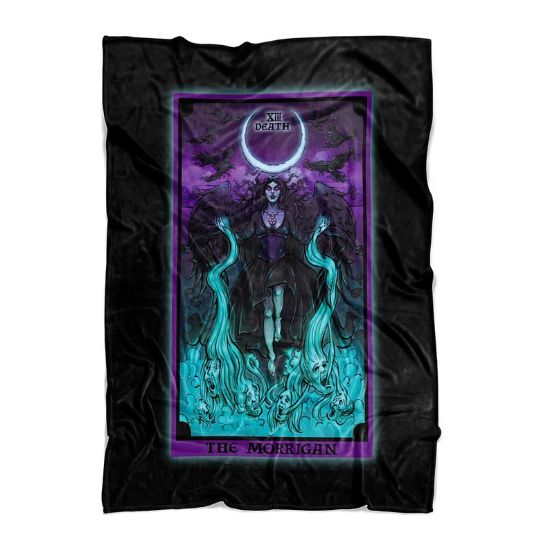 May include: A black fleece blanket with a colorful tarot card design. The card depicts a woman with dark hair and a purple dress, standing in front of a crescent moon. The card is titled "XIII Death" and "The Morrigan".
