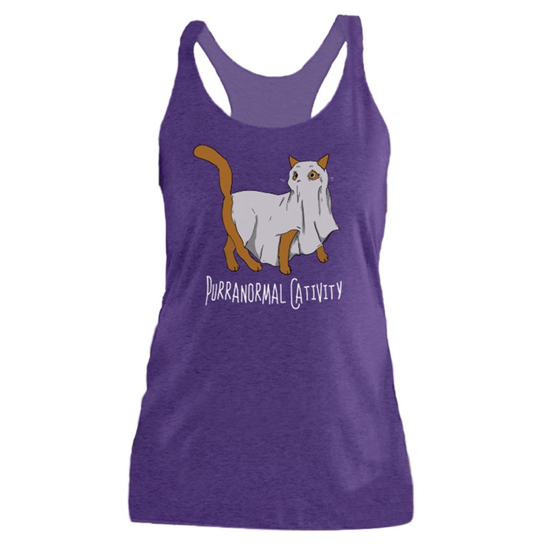 May include: Purple tank top with a graphic of a cat wearing a ghost costume. The text "Purranormal Cativity" is printed below the cat.