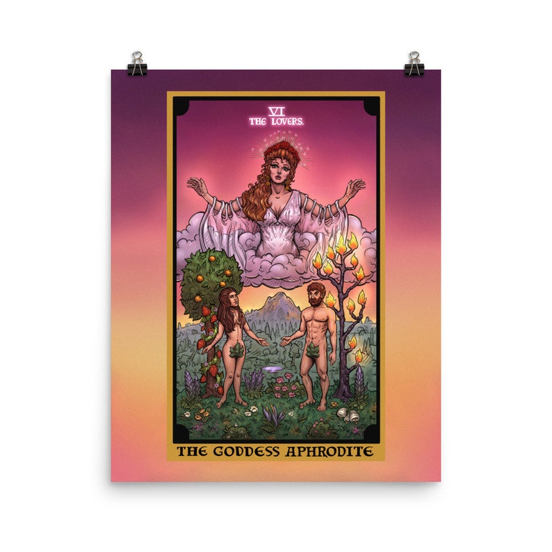 May include: A tarot card illustration depicting the Lovers card, featuring a woman in a white gown with outstretched arms, a man and a woman standing in a garden, and the text "VI THE LOVERS THE GODDESS APHRODITE".