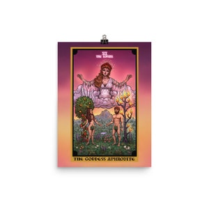 May include: A tarot card illustration of the Lovers card, depicting a woman in a white gown with outstretched arms, floating above a cloud. Below her, a man and woman stand facing each other, with a tree behind each of them. The card is titled "The Lovers" and "The Goddess Aphrodite".