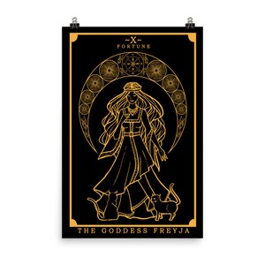May include: A black and gold tarot card with the text "~X~ FORTUNE THE GODDESS FREYJA". The card features a line drawing of a woman with long hair wearing a crown and a long dress. She is standing with two cats at her feet.