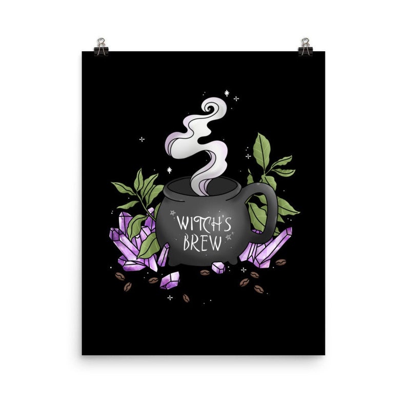 May include: A black cauldron with steam rising from it, surrounded by purple crystals and coffee beans. The cauldron has the text "Witch's Brew" on it.