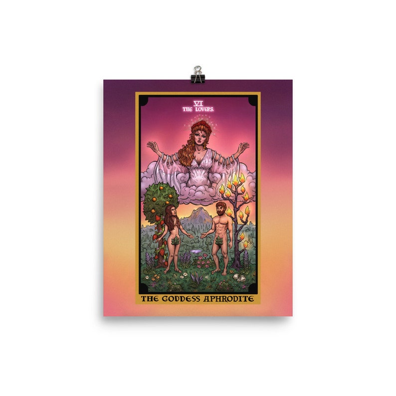 May include: A tarot card illustration of The Lovers, depicting a woman in a white gown with outstretched arms, floating above a cloud. Below her, a man and woman stand facing each other, with a tree behind each of them. The card is titled "The Lovers" and "The Goddess Aphrodite".