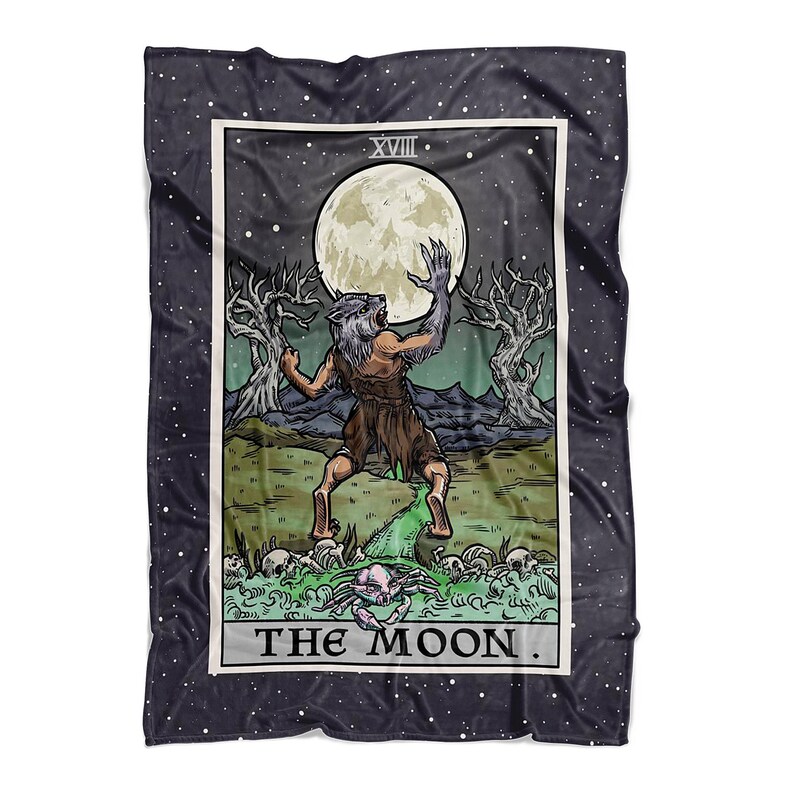 May include: A black and white tarot card with a dark blue background. The card depicts a werewolf-like creature howling at a full moon. The card is labeled "XVIII THE MOON."