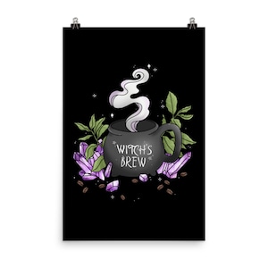 May include: A black cauldron mug with steam rising from it, surrounded by purple crystals and coffee beans. The mug says "Witch's Brew" in white lettering.