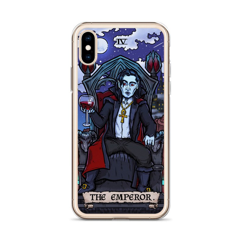 May include: A phone case featuring a colourful illustration of a vampire holding a glass of wine. The illustration is in the style of a tarot card and includes the text "THE EMPEROR."