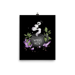 May include: A black cauldron with steam rising from it, surrounded by purple crystals and coffee beans. The cauldron has the text "Witch's Brew" on it.