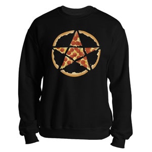 May include: Black sweatshirt featuring a pizza design. The pizza is cut into slices forming a star shape. The pizza has a crust and is topped with pepperoni. The sweatshirt has long sleeves and a crew neck.
