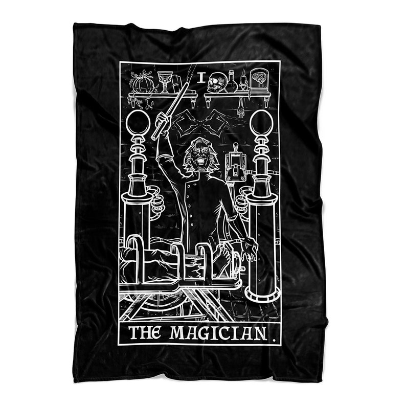 May include: Black and white illustration of a tarot card, The Magician. The card features a man in a suit holding a wand, standing in front of a table with various objects on it. The text "THE MAGICIAN." is at the bottom of the card.