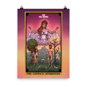 May include: A tarot card illustration of the Lovers card, featuring a woman in a white gown with outstretched arms, floating above a cloud. Below her, a man and woman stand in a garden setting, with a tree in the background. The card is titled "VI THE LOVERS" and "THE GODDESS APHRODITE".