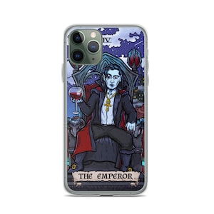 May include: A phone case featuring a colourful illustration of a vampire seated on a throne, holding a glass of wine. The illustration is in the style of a tarot card, with the text "THE EMPEROR" at the bottom.