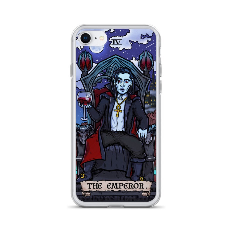 May include: A clear phone case featuring a colourful illustration of a vampire seated on a throne, holding a glass of wine. The illustration is in the style of a tarot card, with the text "THE EMPEROR" at the bottom.