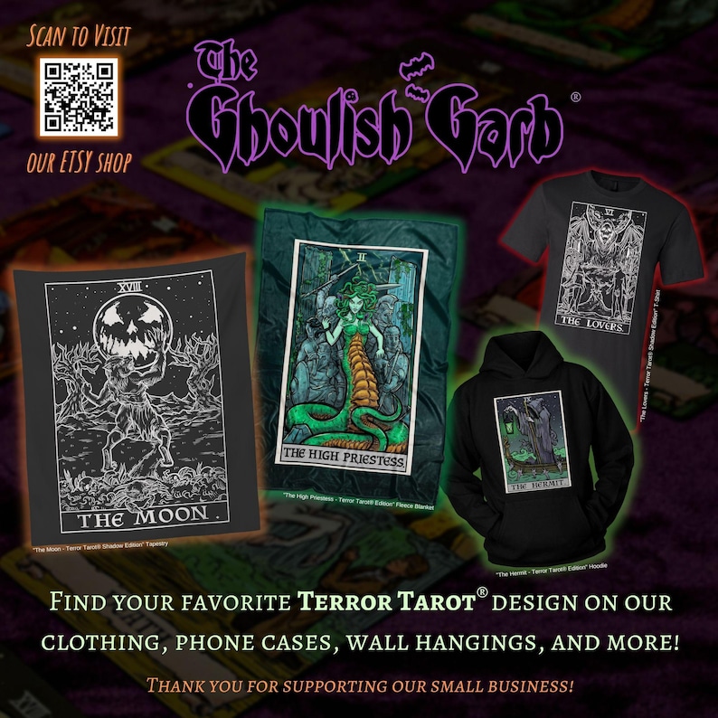 May include: A black and white illustration of the "The Moon" card from the Terror Tarot deck. The card features a man holding a jack-o-lantern head above his head. The card is printed on a black tapestry. The text "The Ghoulish Garb" is printed in white on a black background. The text "Find your favorite Terror Tarot design on our clothing, phone cases, wall hangings, and more!" is printed in white on a black background. The text "Thank you for supporting our small business!" is printed in white on a black background.
