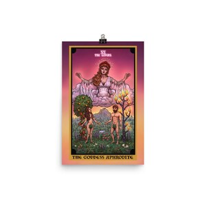 May include: A tarot card illustration of the Lovers card, featuring a woman in a white gown with outstretched arms, standing on a cloud above a man and woman standing in a garden. The card is titled "The Lovers" and "The Goddess Aphrodite".