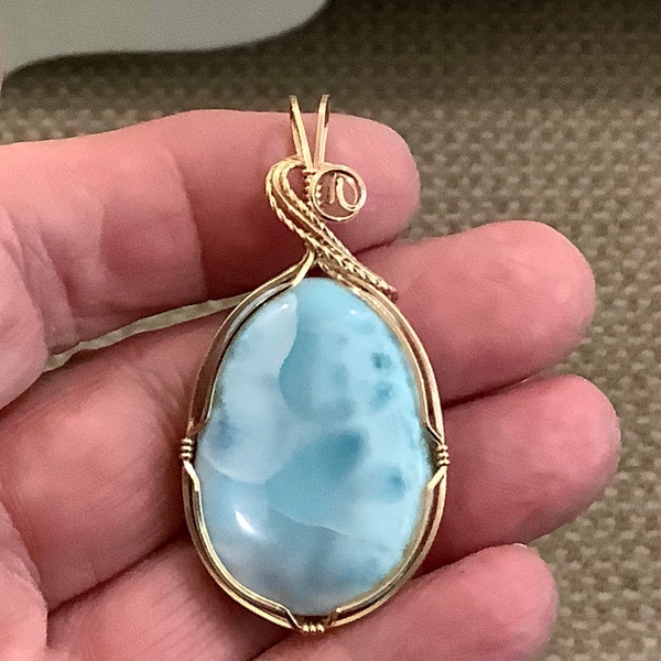 AAA Blue Larimar from the Dominican Republic.  Pendant #357 set in gold.  Old stock.  Top quality.  Natural.