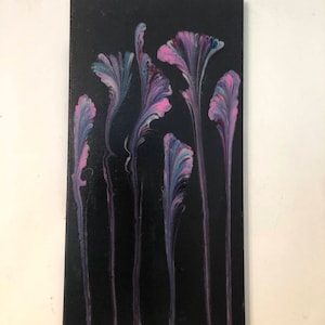 May include: Abstract painting of pink, purple, and blue flowers on a black background.