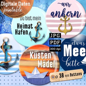 May include: A collection of five circular button designs featuring nautical themes including anchors, sailboats, and paper boats. The designs incorporate text such as Du bist mein Heimat Hafen, wir ankern, Küsten Mädel, and etwas Meer bitte. A label indicates 38 mm buttons.