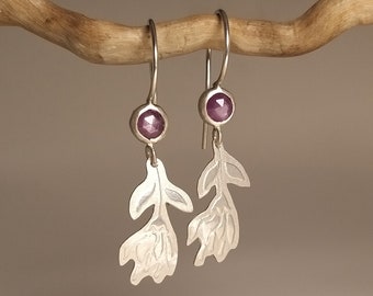 Unique earrings with a rosecut-cut red sapphire set in silver