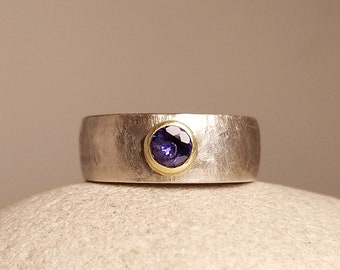 Silver ring with tanzanite set in 750 yellow gold, also engagement ring