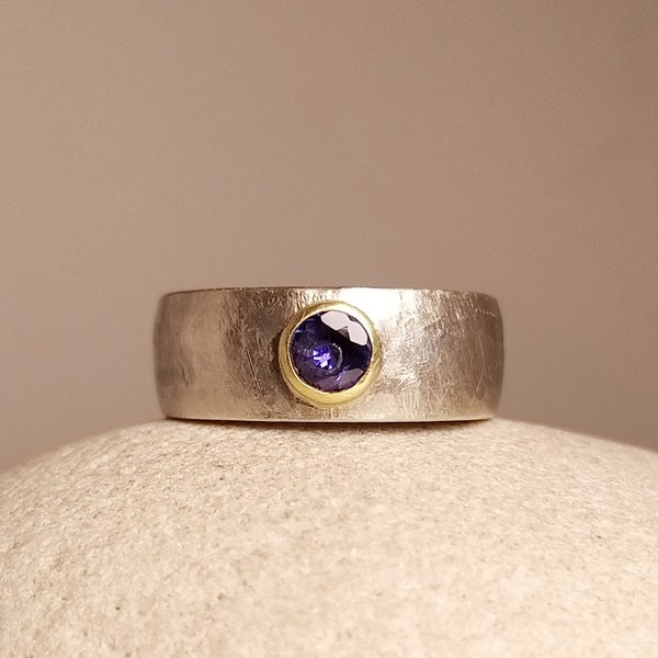 Silver ring with tanzanite set in 750 yellow gold, also engagement ring