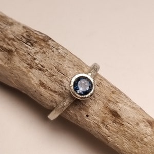 Silver engagement ring with dark blue topaz image 8