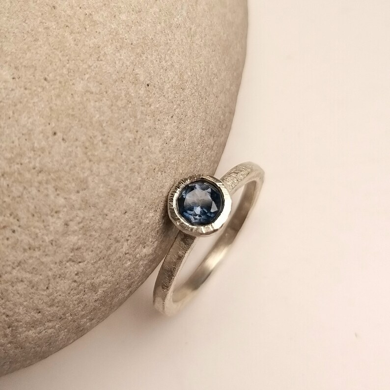 Silver engagement ring with dark blue topaz image 2