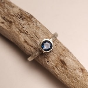 Silver engagement ring with dark blue topaz image 7