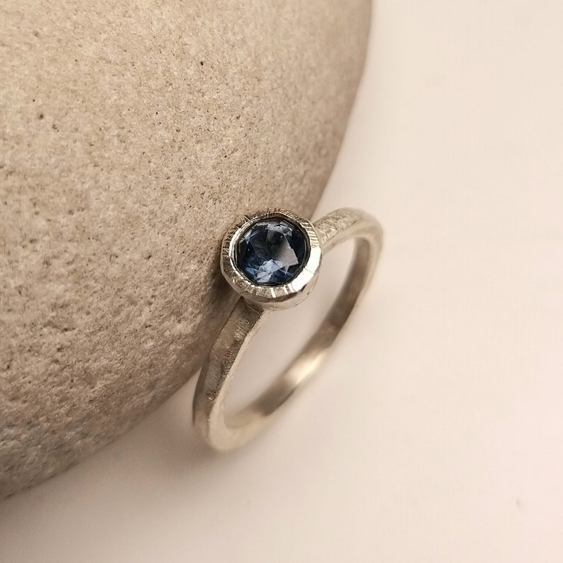 Silver engagement ring with dark blue topaz image 3