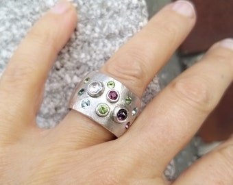 Eye-catching unique ring with sapphire, tourmaline, peridot, topaz and rhodolite