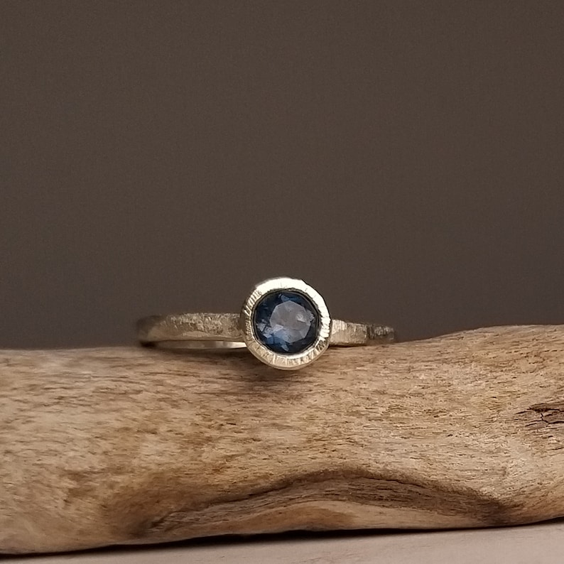 Silver engagement ring with dark blue topaz image 5