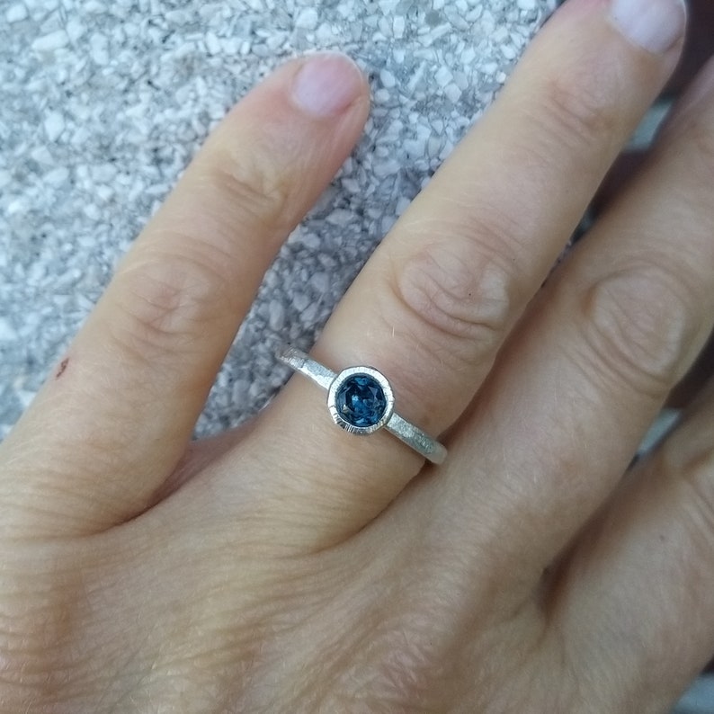 Silver engagement ring with dark blue topaz image 9