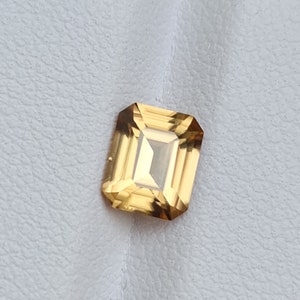 Natural Zircon, light brown/yellow color. 1.97ct, no treatment, emerald cut. CD444