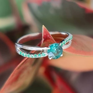 Natural blue tourmaline and emerald ring. Paraiba color tourmaline with Colombian emeralds in silver or gold.
