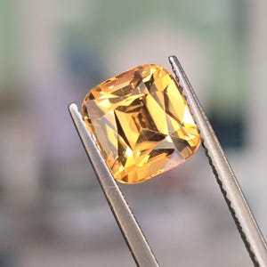 Natural Zircon, Vivid brownish yellow color. 5.68ct, no treatment, Cushion cut. CD1851