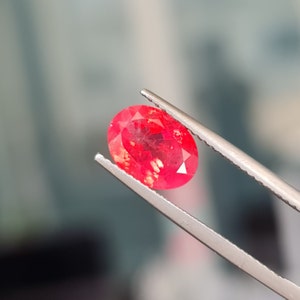 Natural Vivid Red Spinel, 2.30ct. No treatment. Slight tinge of orange. Glowy, Oval shape. Heavy inclusions. Mahenge Spinel, cd817