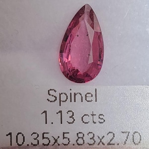 May include: A pink pear-shaped spinel gemstone weighing 1.13 carats. The dimensions are 10.35 x 5.83 x 2.70.