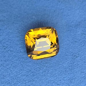 Natural Zircon, Vivid brownish yellow color. 9.21ct, no treatment, Cushion cut. CD1855