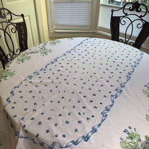 Blue and white printed tablecloth Oval sweet details of serged scalloped borders with blue thread embroidery