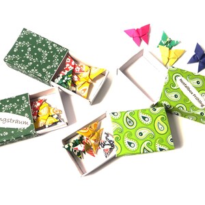 Small box with butterflies as an original souvenir, colorful summer greeting, origami