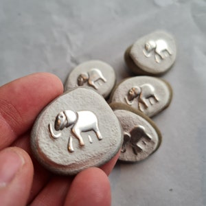 Small double, elephant, lucky charm pebble with silver decorative element